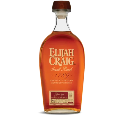 A bottle of Elijah Craig Bourbon 94 Proof Barrel Select with its signature label and amber whiskey alongside a glass.