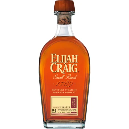 A bottle of Elijah Craig Small Batch Bourbon with its classic label and amber whiskey alongside a glass