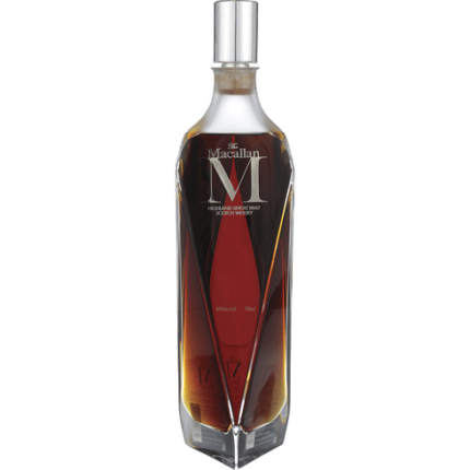 Macallan 'M' Crystal Decanter with stunning geometric design, showcasing its rich amber whisky and luxurious craftsmanship